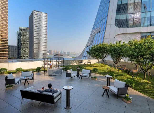 Outdoor terrace at Conrad Hangzhou with modern skyline views in Hangzhou CBD
