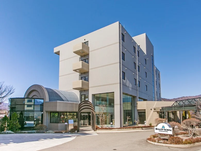 Exterior of Fujisan Station Hotel in Fujiyoshida, Japan, conveniently located within walking distance of Mount Fuji Station for easy access to the Fuji Five Lakes region.