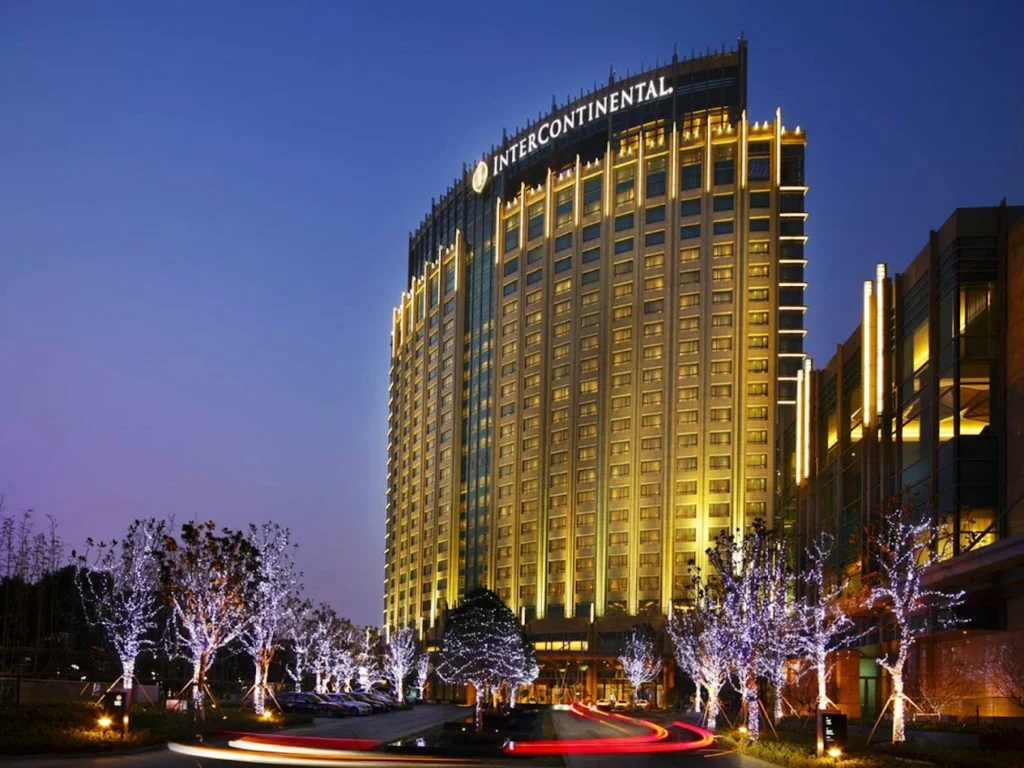 Exterior night view of InterContinental Suzhou, a luxury five-star hotel overlooking Jinji Lake in Suzhou Industrial Park.
