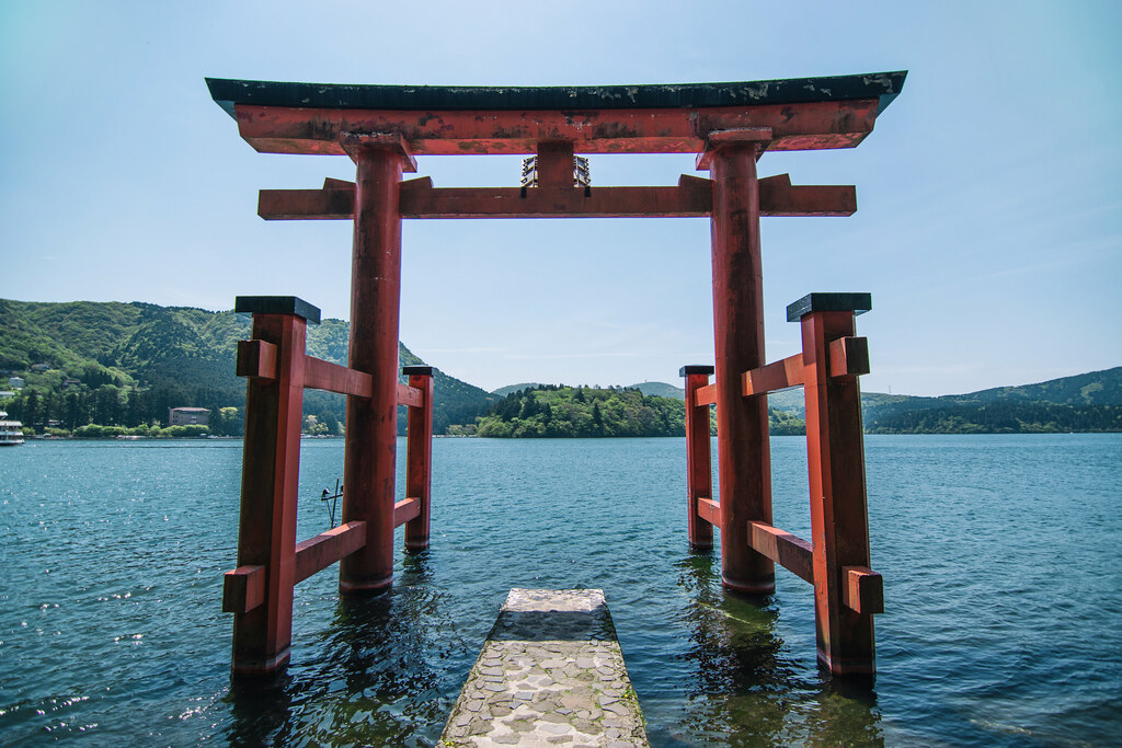 The iconic red torii gate of Hakone Shrine standing in Lake Ashi, one of Hakone's most famous sightseeing landmarks.