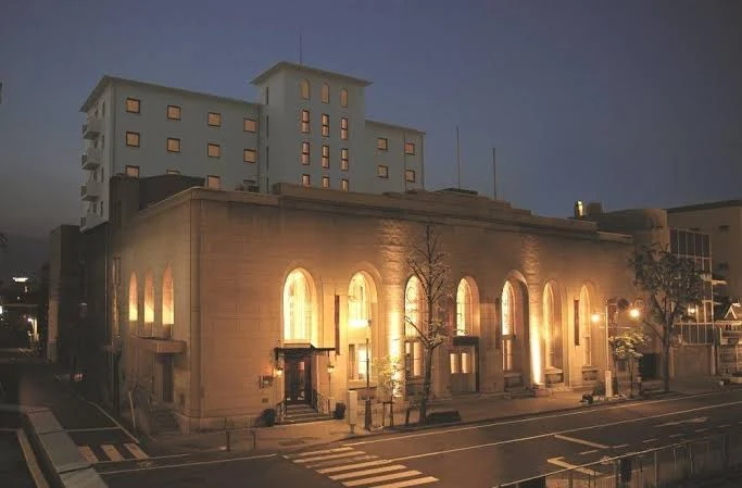 Exterior of Matsumoto Marunouchi Hotel at night, featuring elegant European-inspired architecture near Matsumoto Castle in Matsumoto, Japan.