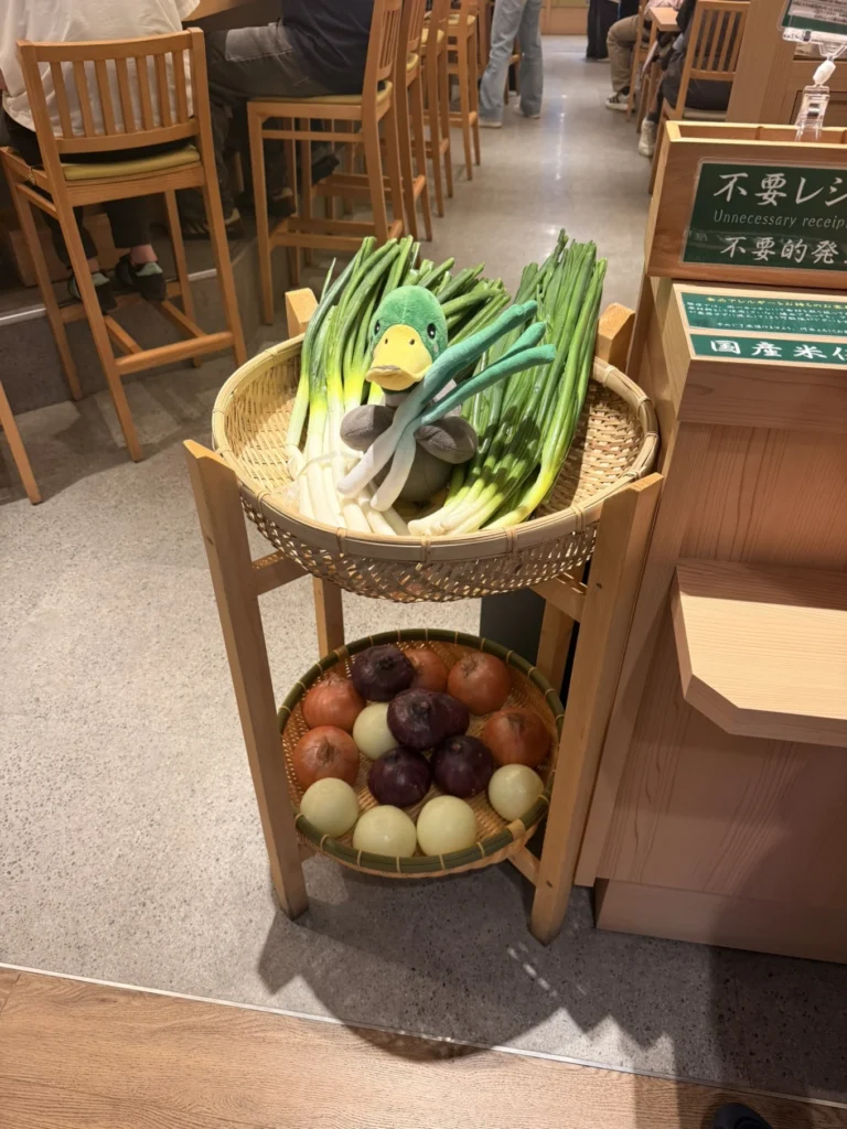 Decorative display of fresh Japanese spring onions and onions inside Ramen Kamo to Negi Osaka