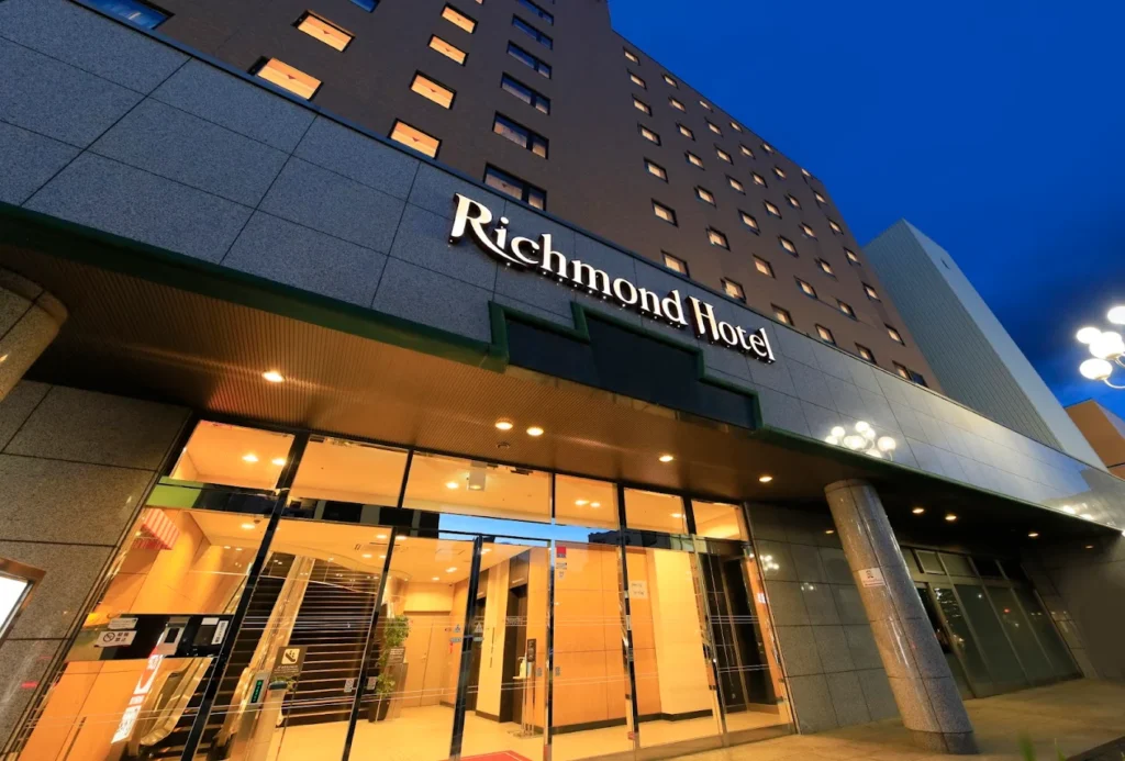 Exterior of Richmond Hotel Matsumoto at night, featuring its modern façade and illuminated entrance near Matsumoto Station, Japan.