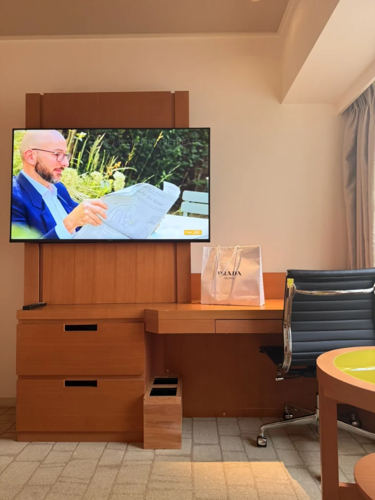 Work desk and television inside Swiss Advantage Room