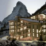 THE OMNIA luxury hotel beneath the snow-covered Matterhorn in Zermatt, Switzerland