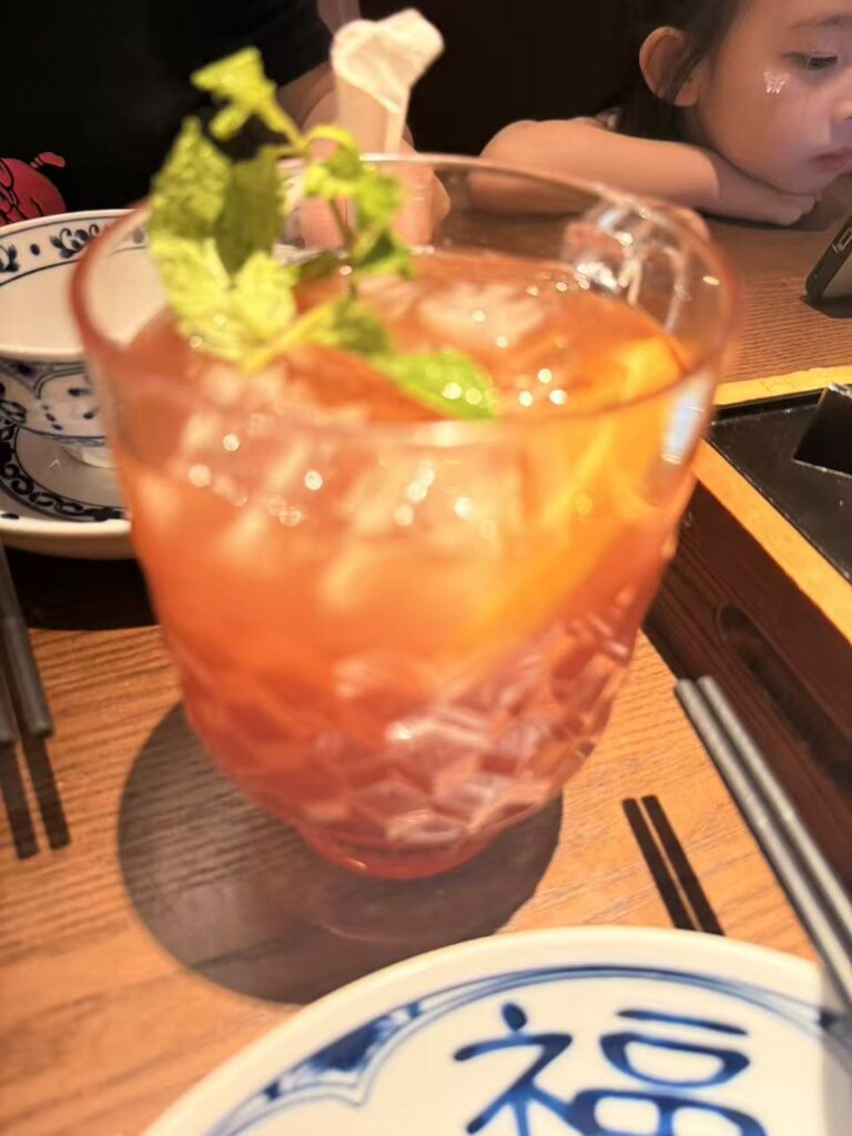 Nong Geng Ji Jewel Review: Family-Friendly Hunan Food at Changi Airport 11 Pink iced fruit tea with orange slices and mint at Nong Geng Ji Jewel