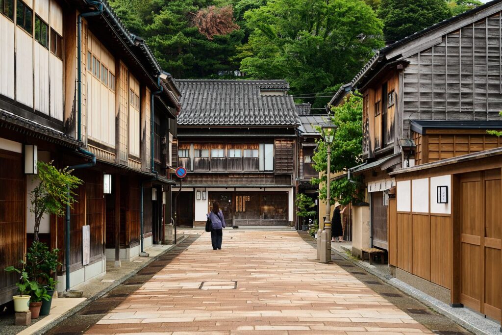 Traditional wooden machiya houses lining a quiet street in Kanazawa's Higashi Chaya District, one of the best areas to stay in Kanazawa for culture and historic charm.