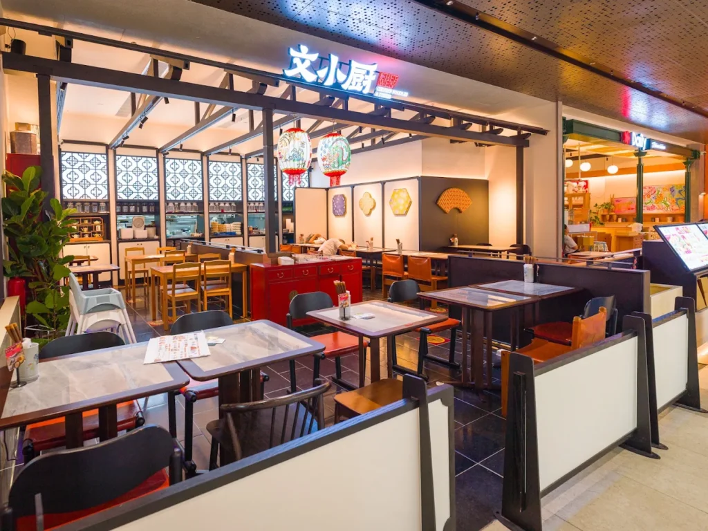 Lentor Modern Food Guide: 17 Best Places To Eat Near Lentor MRT 7 Chef Wen Chinese restaurant interior at Lentor Modern, featuring traditional lanterns, wooden tables and open seating.