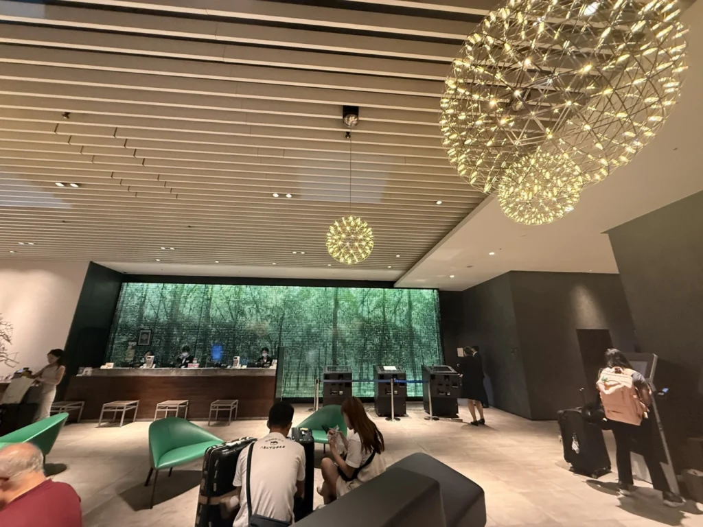 Hotel Vischio Osaka Review: A Modern, Better-Value Stay Near Osaka Station 3 Hotel Vischio Osaka lobby with reception desk, self check-in kiosks and modern lighting