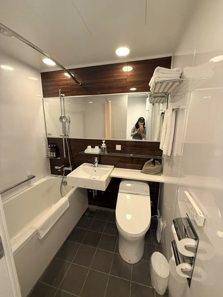 Hotel Vischio Osaka Review: A Modern, Better-Value Stay Near Osaka Station 6 Hotel Vischio Osaka bathroom with bathtub, washbasin and Japanese bidet toilet