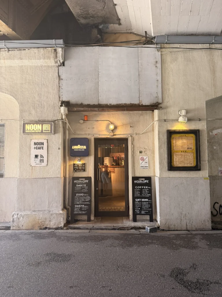 Nakazakicho Osaka City Walk: Exploring Osaka's Retro Neighbourhood 8 NOON + CAFE entrance in Nakazakicho Osaka beneath the railway tracks