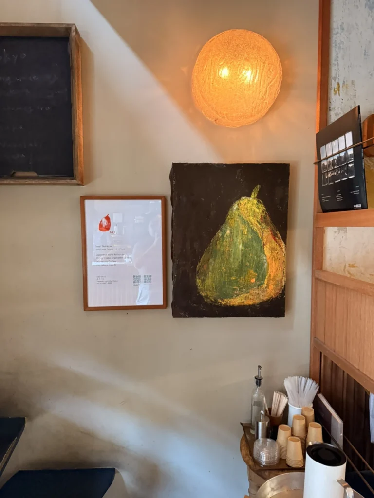 Nakazakicho Osaka City Walk: Exploring Osaka's Retro Neighbourhood 14 Pear artwork and warm lighting inside neel Nakazakicho cafe
