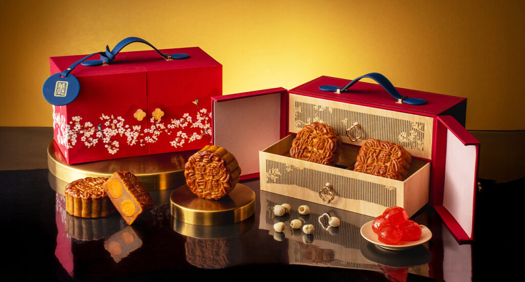 Hua Ting at Orchard Hotel Singapore traditional baked mooncakes displayed in elegant red Mid-Autumn Festival gift boxes